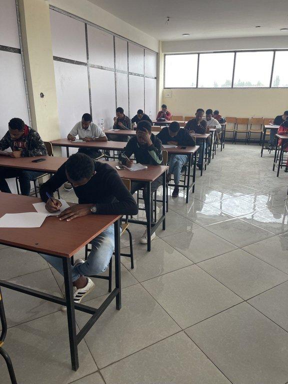 Degree students during the exam - Cover Image